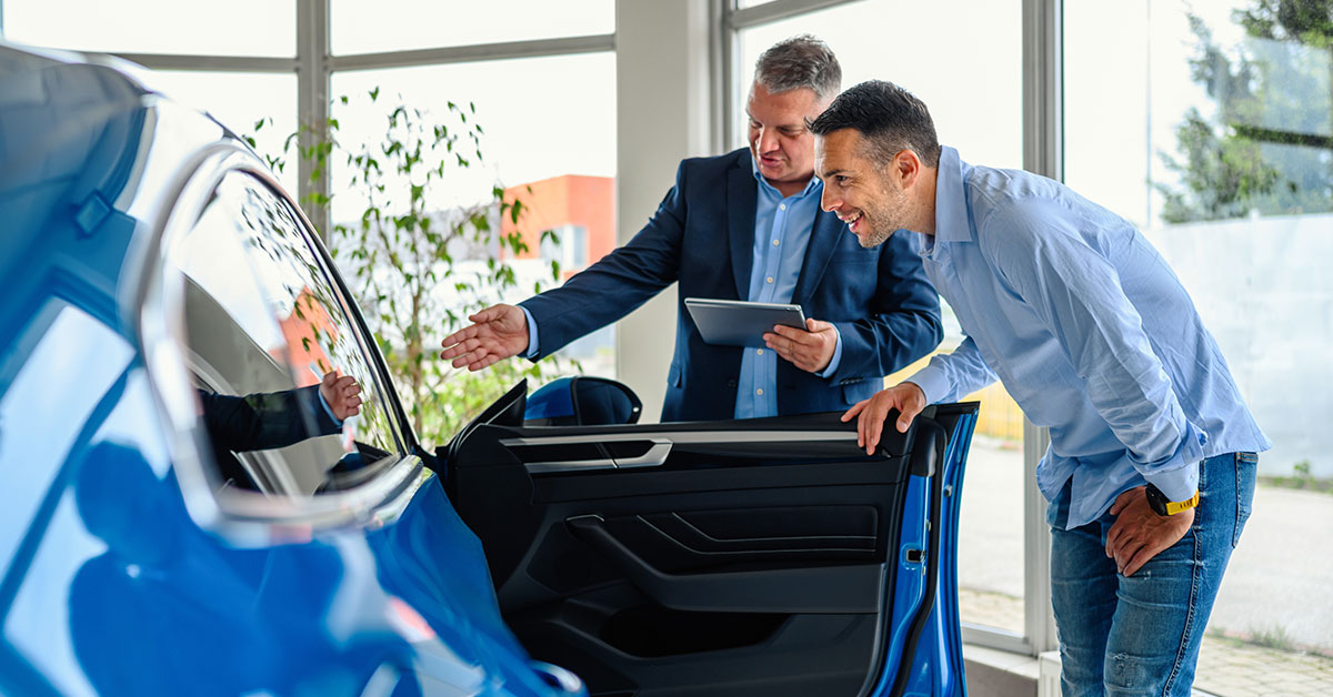man buying new car